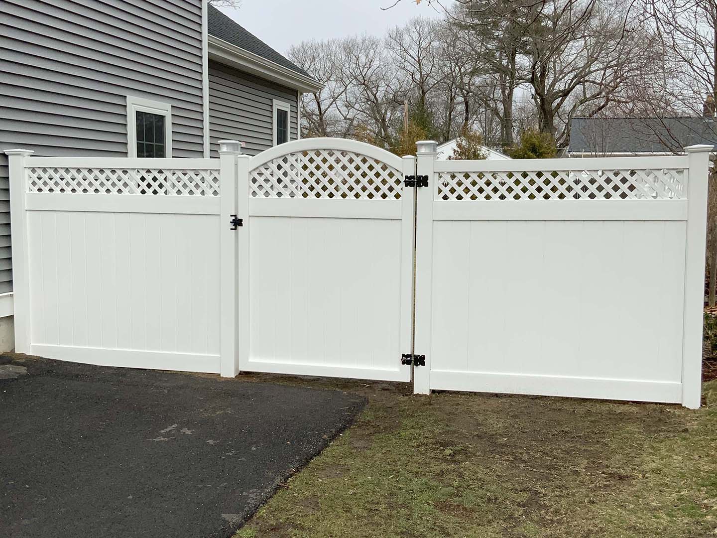 Arched walk gate set into a privacy fence, Merrimack Valley MA