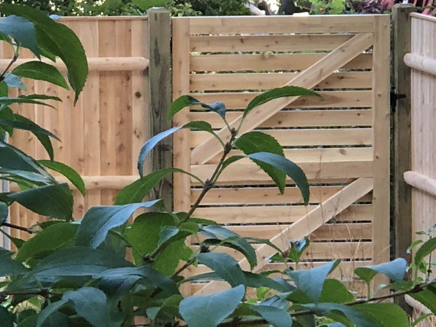 Tall cedar privacy fence with lattice top, Merrimack Valley MA
