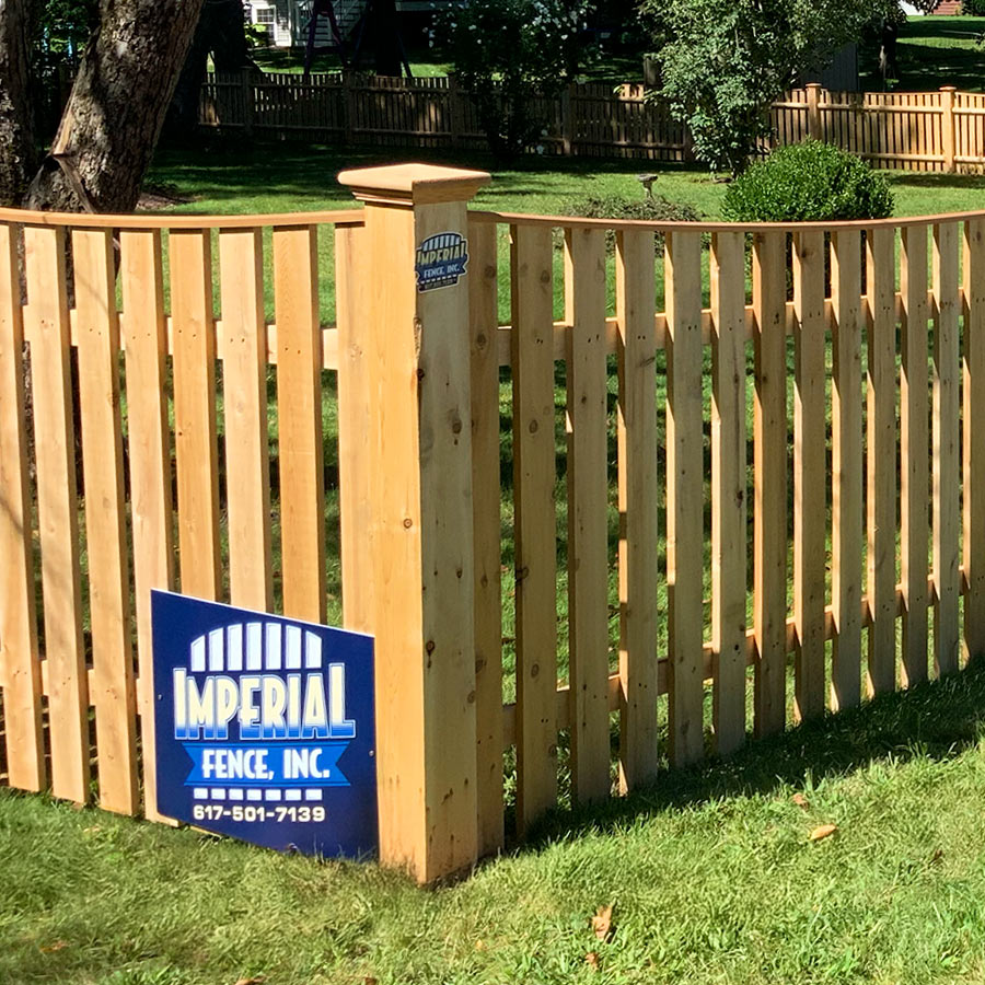 Imperial Fence crew installing a fence for a Tewksbury, Massachusetts homeowner